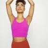 Nike Performance THE YOGA LUXE CROP TANK - Top - Cactus /villain Red
