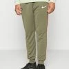 Nike Performance FC LIBERO PANT - Tracksuit Bottoms - Medium Olive/habanero Red/white
