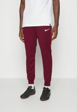 Nike Performance FC LIBERO PANT - Tracksuit Bottoms - Dark Beetroot/habanero Red/white