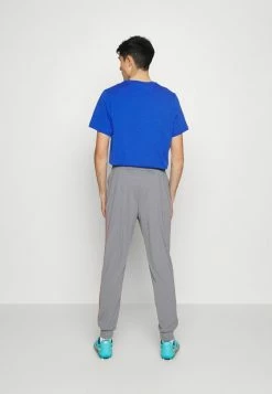 Nike Performance FC LIBERO PANT - Tracksuit Bottoms - Cool Grey/habanero Red/white -Nike Performance store 0b9d1ebcb23148f7adcfd9ef41a010d1