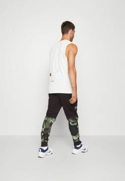 Nike Performance PANT TAPER CAMO - Tracksuit Bottoms - Velvet Brown/coconut Milk -Nike Performance store 171d6939f71a43fea95a050c949c7a63