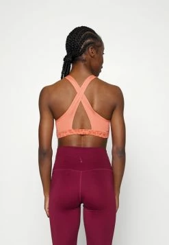 Nike Performance BRA - Medium Support Sports Bra - Madder Root/madder Root/white -Nike Performance store 19f61391ab4748559a4581913810f2e2