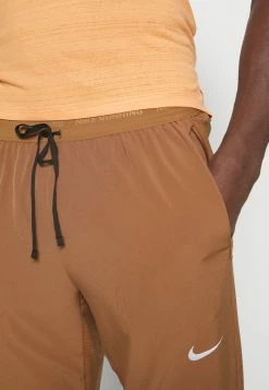 Nike Performance ELITE PANT - Tracksuit Bottoms - Ale Brown/silver -Nike Performance store 2599ee8a56124f79b7042682b3b4fd36