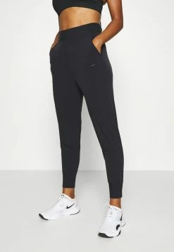 Nike Performance BLISS PANT - Tracksuit Bottoms - Black