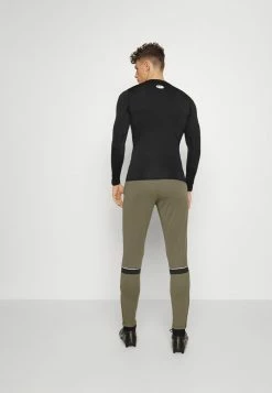 Nike Performance ACADEMY PANT - Tracksuit Bottoms - Medium Olive/white/night Forest/white -Nike Performance store 304b37fb678a4919ab99f1ff3c457b1f