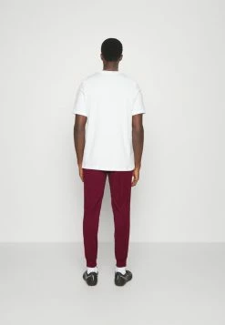 Nike Performance FC LIBERO PANT - Tracksuit Bottoms - Dark Beetroot/habanero Red/white -Nike Performance store 32d957de2bc6436ea55cfc82eccd51b7