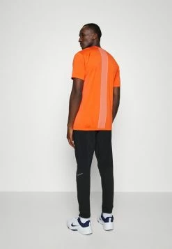 Nike Performance DRY PANT - Tracksuit Bottoms - Black/cinnabar -Nike Performance store 348c532565324a95931cd8cf4ae59423