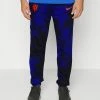Nike Performance NETHERLANDS KNVB FLEECE PANT - Tracksuit Bottoms - Black/deep Royal Blue/habanero Red