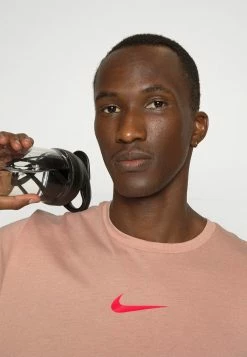 Nike Performance BURNOUT - Sports T-shirt - Rose Whisper/atmosphere/siren Red -Nike Performance store 3ac42c4c51b9479ca0a62734f829bf8d