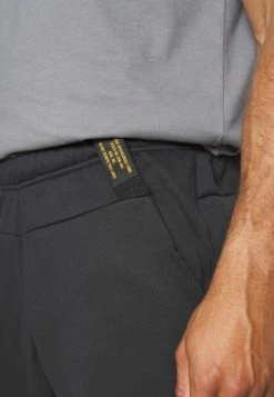 Nike Performance PANT TAPER CAMO - Tracksuit Bottoms - Black/coconut Milk -Nike Performance store 3ecfec0707204f8f82fdd463f6dcef26