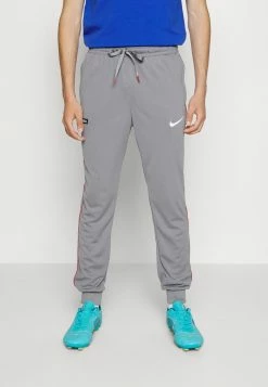 Nike Performance FC LIBERO PANT - Tracksuit Bottoms - Cool Grey/habanero Red/white
