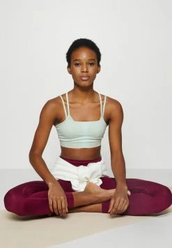 Nike Performance INDY SEAMLESS BRA - Light Support Sports Bra - Sanddrift/mint Foam/grey Fog -Nike Performance store 4598397be4bc4a9c9d675a62c95b39f0