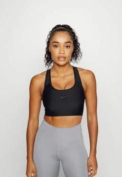 Nike Performance SEAMLESS BRA - Medium Support Sports Bra - Black/dark Smoke Grey