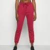 Nike Performance THERMA FIT ALL TIME - Tracksuit Bottoms - Pomegranate/black