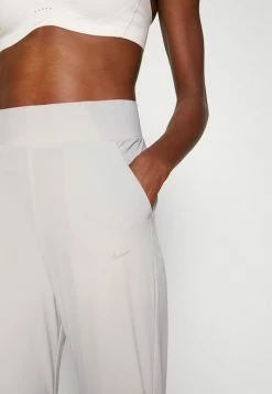 Nike Performance BLISS PANT - Tracksuit Bottoms - Light Iron/ore Clear -Nike Performance store 60b35e3728704d65af92f510451cdd7c