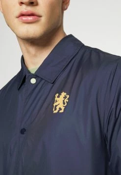 Nike Performance CHELSEA LONDON COACH - Club Wear - Blackened Blue/jersey Gold 11 Nike Performance CHELSEA LONDON COACH - Club Wear - Blackened Blue/jersey Gold -Nike Performance store 614603b13e15426abf149ea40ee39ff0