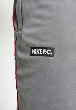 Nike Performance FC LIBERO PANT - Tracksuit Bottoms - Cool Grey/habanero Red/white -Nike Performance store 6c804d3ab3714fe1be2245f4ee7a7682