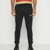 Nike Performance FC LIBERO PANT - Tracksuit Bottoms - Black/habanero Red/white