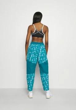 Nike Performance PANT - Tracksuit Bottoms - Bright Spruce/cave Purple/gold -Nike Performance store 876844ef08ec4c7295f6c279bfb5f808