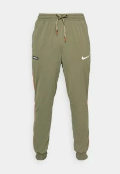 Nike Performance FC LIBERO PANT - Tracksuit Bottoms - Medium Olive/habanero Red/white -Nike Performance store 88c1d4fc7dfa477ab8021bed2bcd2eb4