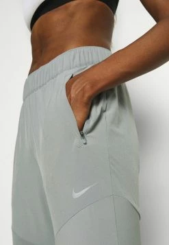 Nike Performance ESSENTIAL PANT - Tracksuit Bottoms - Particle Grey/silver -Nike Performance store 943e44ed1489451ca2996720d1e4660a