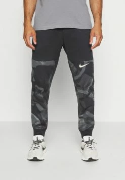 Nike Performance PANT TAPER CAMO - Tracksuit Bottoms - Black/coconut Milk