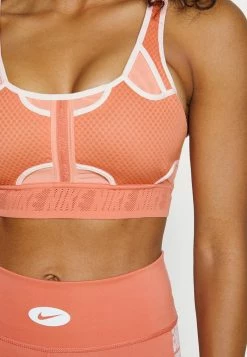 Nike Performance BRA - Medium Support Sports Bra - Madder Root/atmosphere -Nike Performance store a0af889fec884c9b9d0bc9c1810e04c5