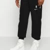 Nike Performance NBA NO TEAM STANDARD ISSUE PANT - Tracksuit Bottoms - Black/pale Ivory