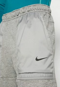 Nike Performance PANT TAPER NOVELTY - Tracksuit Bottoms - Dark Grey Heather/particle Grey/black -Nike Performance store adb4233748fe4d6885ae6722c6b55524