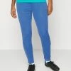 Nike Performance ACADEMY - Tracksuit Bottoms - Marina Blue/black