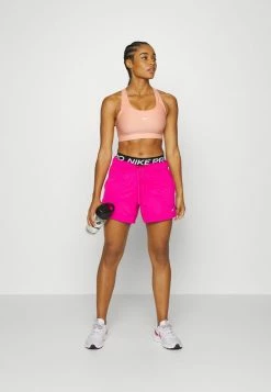 Nike Performance SEAMLESS BRA - Medium Support Sports Bra - Light Madder Root White