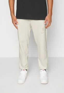 Nike Performance NBA NO TEAM STANDARD ISSUE PANT - Tracksuit Bottoms - Phantom Heather/rattan
