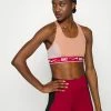Nike Performance LOGO BRA - Medium Support Sports Bra - Rose Whisper/mystic Hibiscus/white