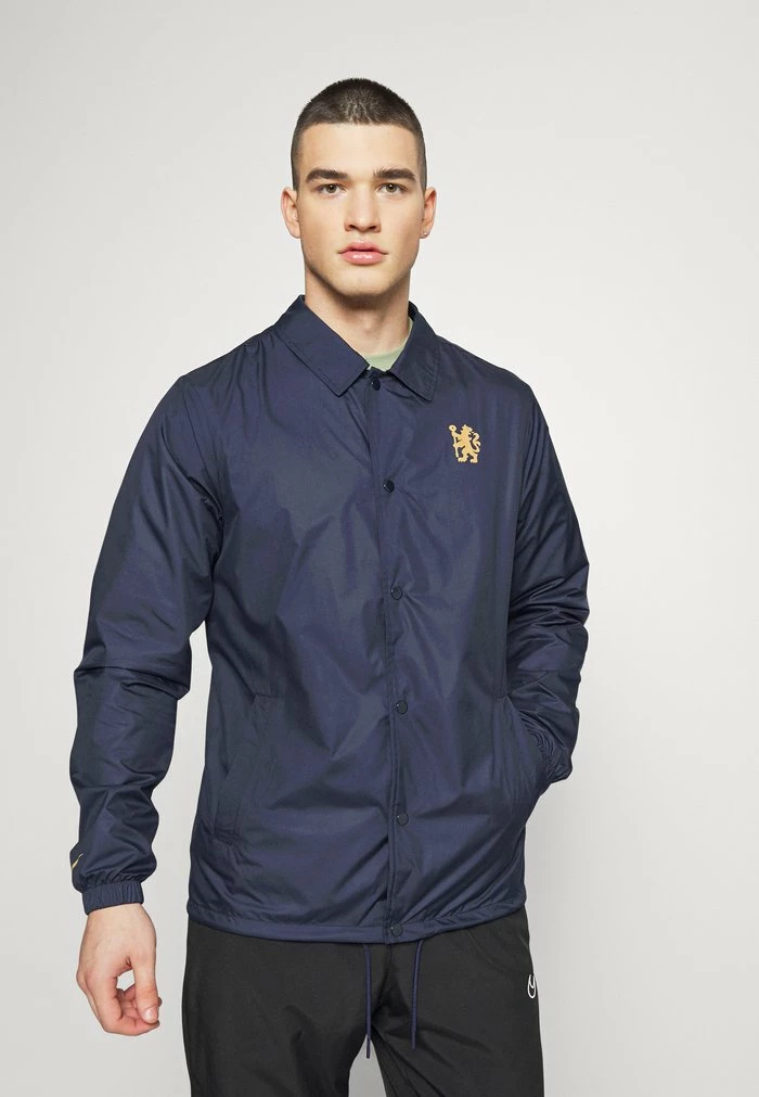 Nike Performance CHELSEA LONDON COACH - Club Wear - Blackened Blue/jersey Gold 1 Nike Performance CHELSEA LONDON COACH - Club Wear - Blackened Blue/jersey Gold