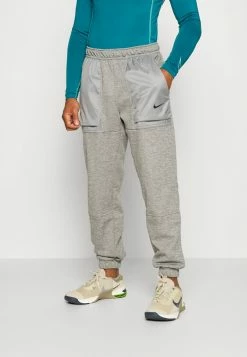 Nike Performance PANT TAPER NOVELTY - Tracksuit Bottoms - Dark Grey Heather/particle Grey/black