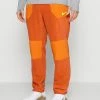 Nike Performance WNTRIZED PANT - Tracksuit Bottoms - Burnt Sunrise/sport Spice/total Orange