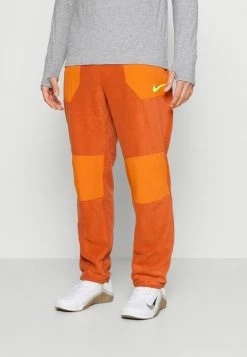 Nike Performance WNTRIZED PANT - Tracksuit Bottoms - Burnt Sunrise/sport Spice/total Orange