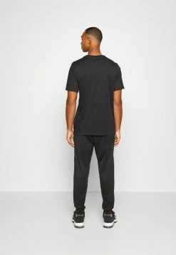 Nike Performance PANT TAPER - Tracksuit Bottoms - Black/white -Nike Performance store e04b7f5892e7439799de470567049671