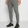 Nike Performance PANT TAPER - Tracksuit Bottoms - Charcoal Heather/black