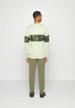 Nike Performance FC LIBERO PANT - Tracksuit Bottoms - Medium Olive/habanero Red/white -Nike Performance store e81934c1c4ea4f38a72cd52714b46109