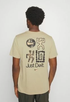 Nike Performance TEE - Sports T-shirt - Limestone -Nike Performance store f9b140248c60488e955a05fe2ff00dd8